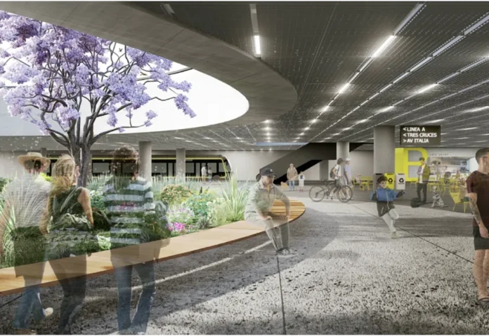 Render de una estación subterránea del sistema BRT del proyecto de reforma del transporte metropolitano de Montevideo, con andén, ómnibus articulado y señalización hacia Tres Cruces y Avenida Italia.
